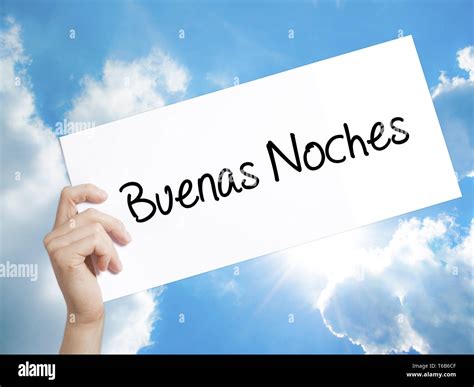 Buenas Noches (Good Night In Spanish) Sign on white paper. Man Hand ...