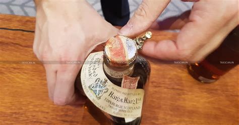 Mere opening, breaking or uncorking of liquor bottle by twisting seal ...