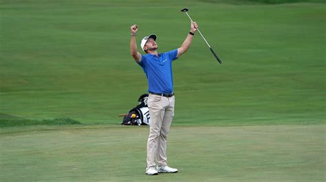 Download Mackenzie Hughes Celebrating Arms Up Wallpaper | Wallpapers.com