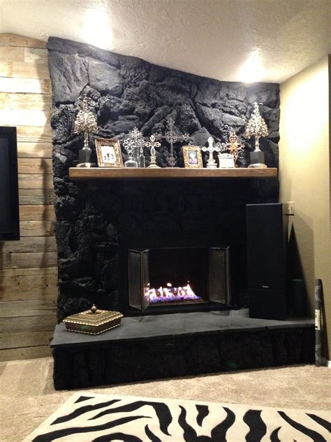 Black Painted Lava Rock Fireplace with Glass Rocks