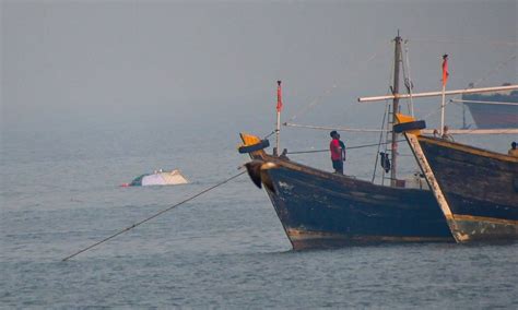 Search operation on for 7-yr-old boy missing after ferry-Navy craft crash