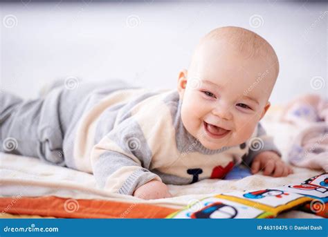 Happy Gurgling Baby Lying on His Bed Stock Image - Image of newborn ...