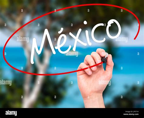 Man Hand writing Mexico (In Spanish) with black marker on visual screen ...