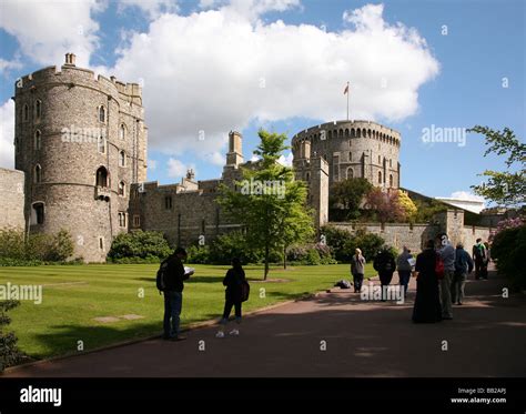 Visitors at Windsor Castle in the town of Windsor on the River Thames ...