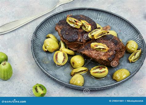 Grilled Ostrich Steak with Kiwi Berries Stock Image - Image of fork ...