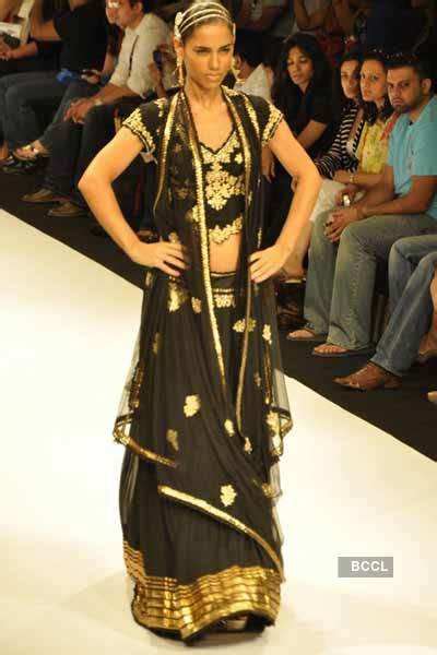 A model walks the runway to showcase a creation by designer Rocky S on ...