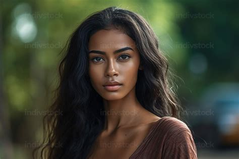 Free Download - a young attractive woman with direct eye contact, middle-dark skin, - Stock ...