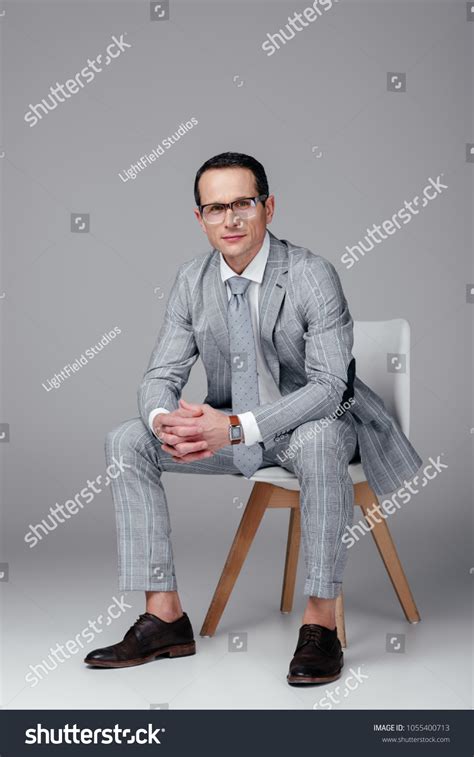 Suit Man Sitting 的图像结果