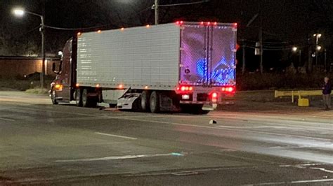 Detroit man charged after crashing Tesla under semi-truck, critically ...