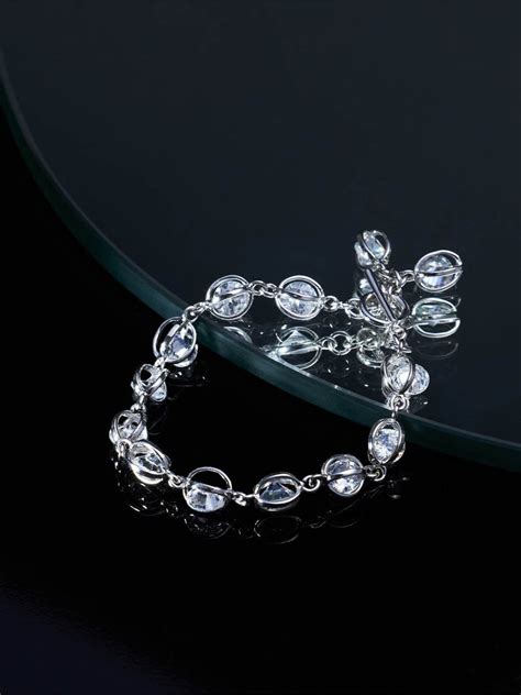 Beruzu - Silver Plated Oval Loop Bracelet with Embedded Stone Accents ...