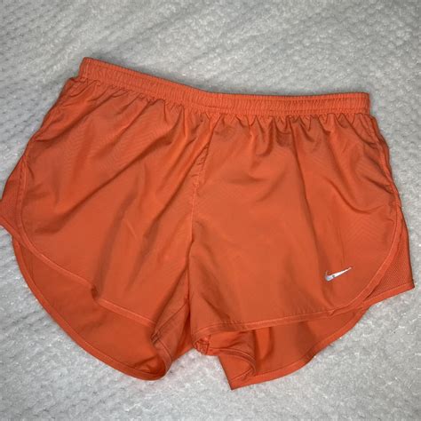 Orange Nike running shorts size medium Dri-fit... - Depop