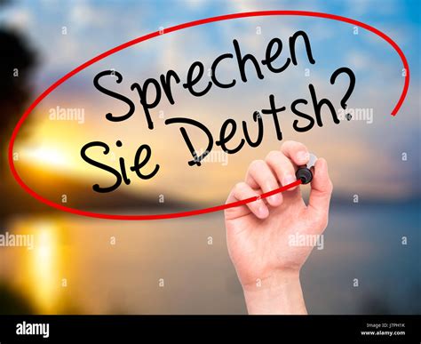 Man Hand writing Do You Speak German? (in German) with black marker on ...
