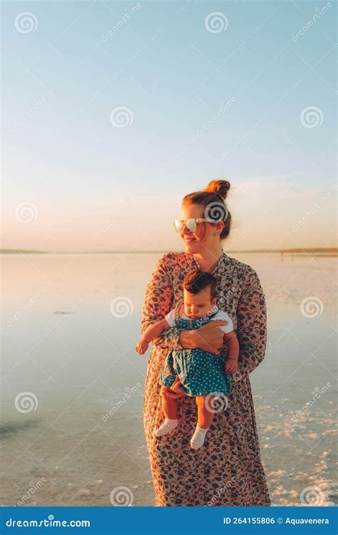Mother with Son Enjoying Sunset on the Beach Stock Photo - Image of ...