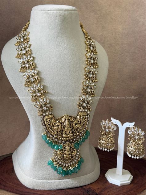 KUNDAN WHITE STONE LOTUS HARAM SET WITH GOLD TONE LAKSHMI PENDANT WITH ...