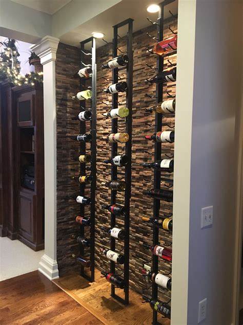 A wine cellar made up of VintageView wine racks on a floor to ceiling ...