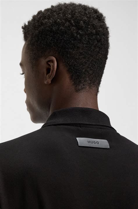 HUGO - Relaxed-fit polo shirt in mercerised stretch-cotton piqué - Black