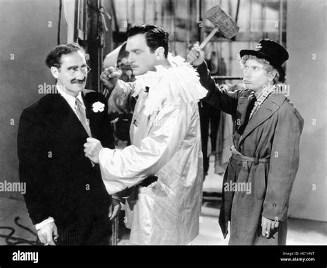 A NIGHT AT THE OPERA, from left, Groucho Marx, Walter Woolf King, Harpo ...