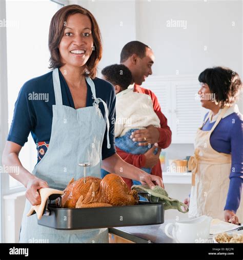 Black woman preparing Thanksgiving dinner Stock Photo - Alamy