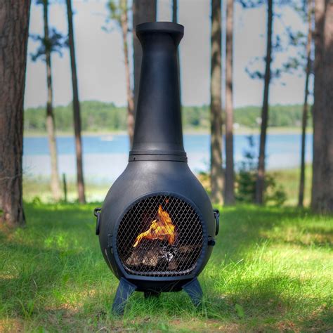 industrial style chiminea in a green garden on grass Clay Chiminea ...