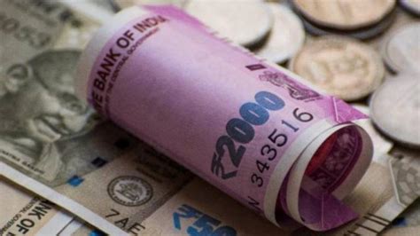 Rupee declines by 27 paise to a week's low on fresh trade concerns ...