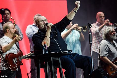 Phil Collins, 68, performs from his chair during concert in Berlin ...