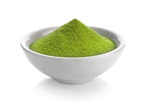 Green tea powder in a bowl on white space | Premium Photo