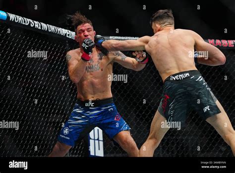 MIAMI, FL - APRIL 12:Darren Elkins and Julian Erosa meet in the octagon ...