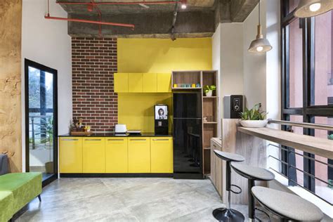 This tech office is a cafe, workspace and hostel rolled into one ...