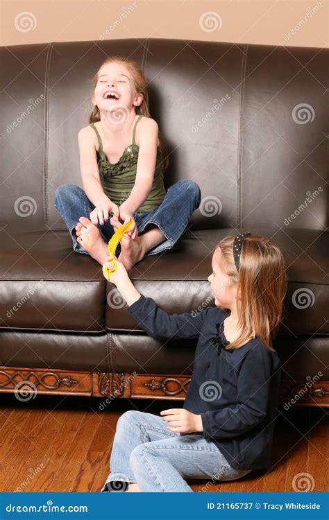 Children Tickling Feet with Feather Stock Image - Image of children ...