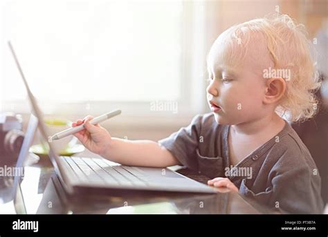 Baby Using Computer 的图像结果
