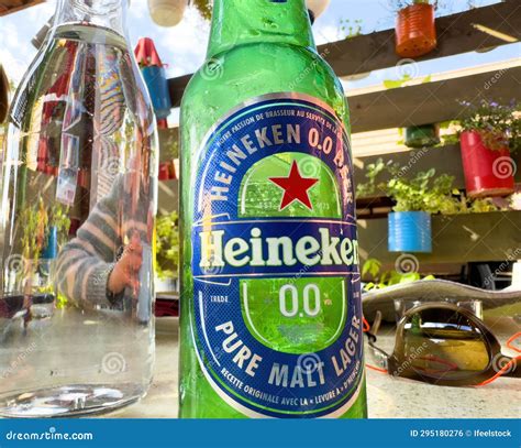Non-Alcoholic Heineken Bottle beside Water at Terrace Editorial Photo ...