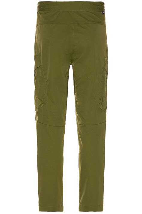 Nike Utility Pant Cropped in Rough Green & Black | REVOLVE
