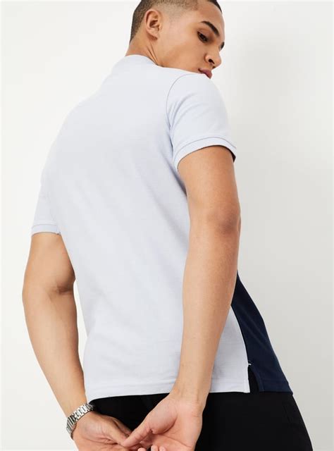 Buy Men Slim Fit Colourblocked Polo T-shirt Online at just Rs. 699.0 ...
