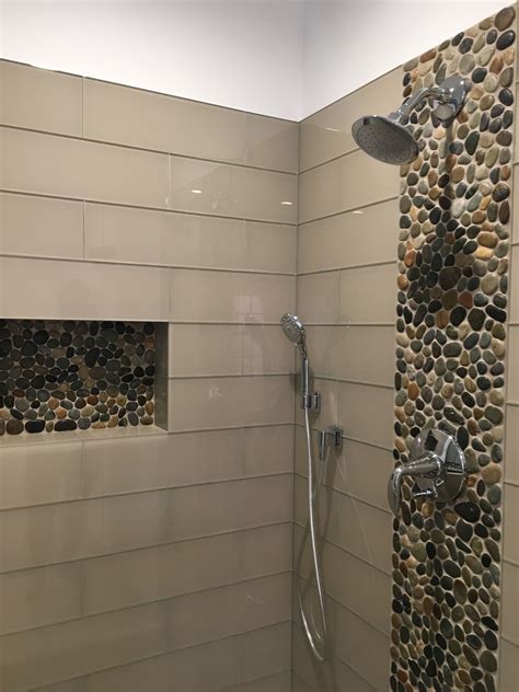 Stunning accent strip and niche using Glazed Bali Ocean Pebble Tile ...