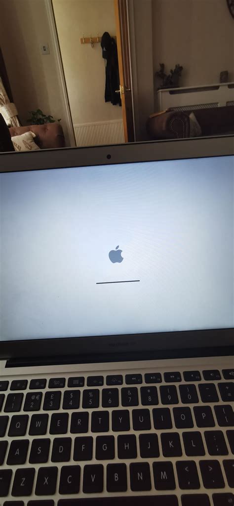 My mac book has been stuck on this for like a week now how do i fix it ...