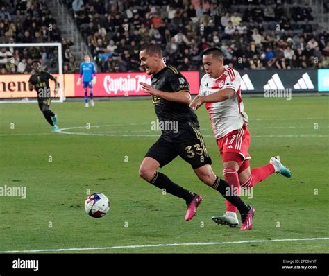 March 12, 2023: LAFC defender Aaron Long is pursued by New England ...
