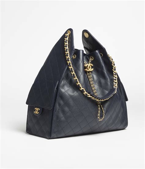 Chanel 25 large handbag, Grained calfskin & gold-tone metal, dark blue ...