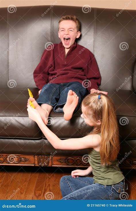 Children Tickling Feet with Feather Stock Photo - Image of brother ...