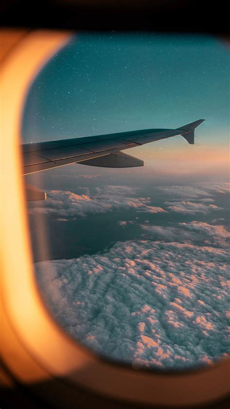 Download wallpaper 2160x3840 porthole, airplane window, airplane wing ...