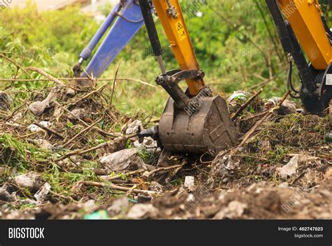 Image result for Backhoe Digging Hole