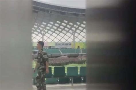 Chinese military personnel parade near Hong Kong border