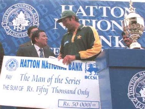 Wasim Akram collecting his cheque for the man of the series ...