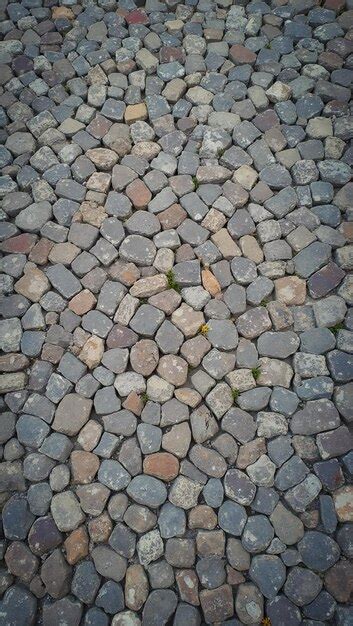 Historic cobblestone street with worn gray and brown stones | Premium ...
