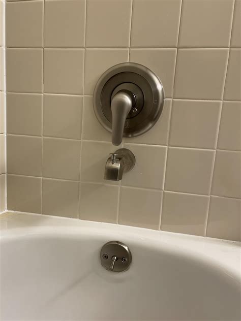 Wanted to recaulk the bathtub and one of the tiles pushed in…one week ...