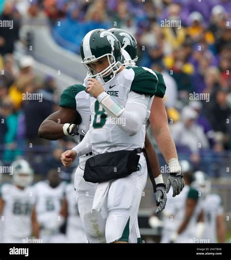 Michigan State quarterback Kirk Cousins looks down during the first ...
