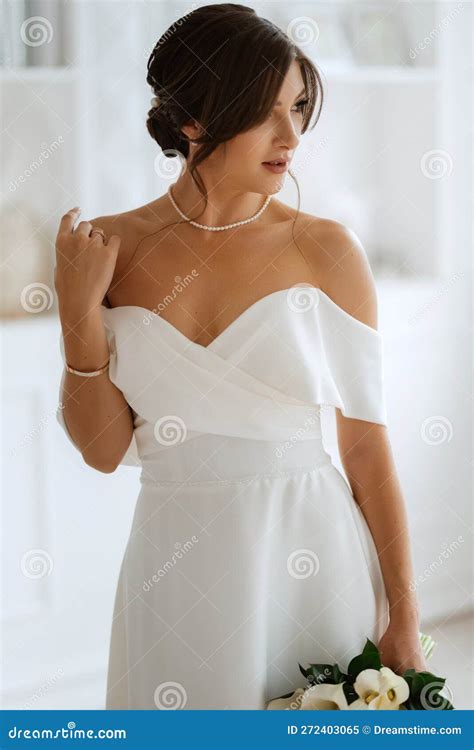 Brunette Bride in a Tight Wedding Dress in a Bright Studio Stock Image - Image of girl, wedding ...