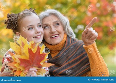 Granny and Granddaughter Posing Outdoors Stock Image - Image of face ...