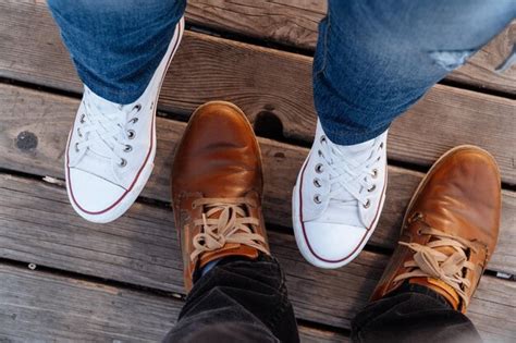 Feet on a wooden plank surface | Premium Photo