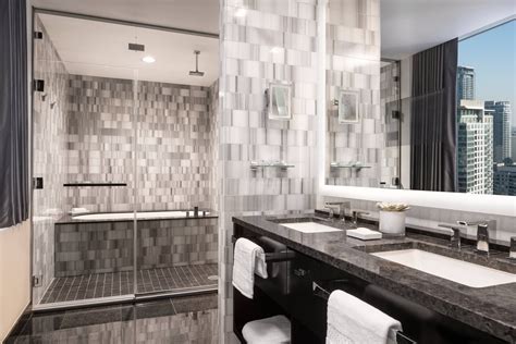 The Ritz-Carlton bath robes hanging in luxury bathroom