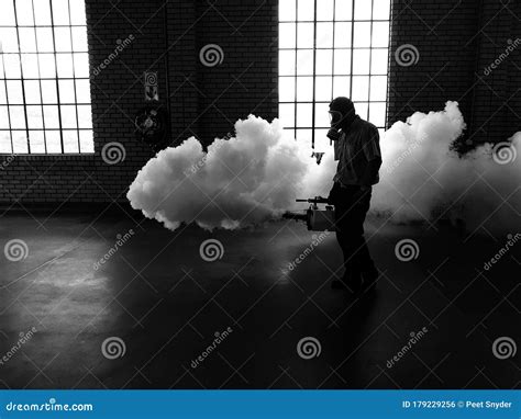 Fogging Machine Blowing Smoke Stock Photo - Image of blowing, darkness ...